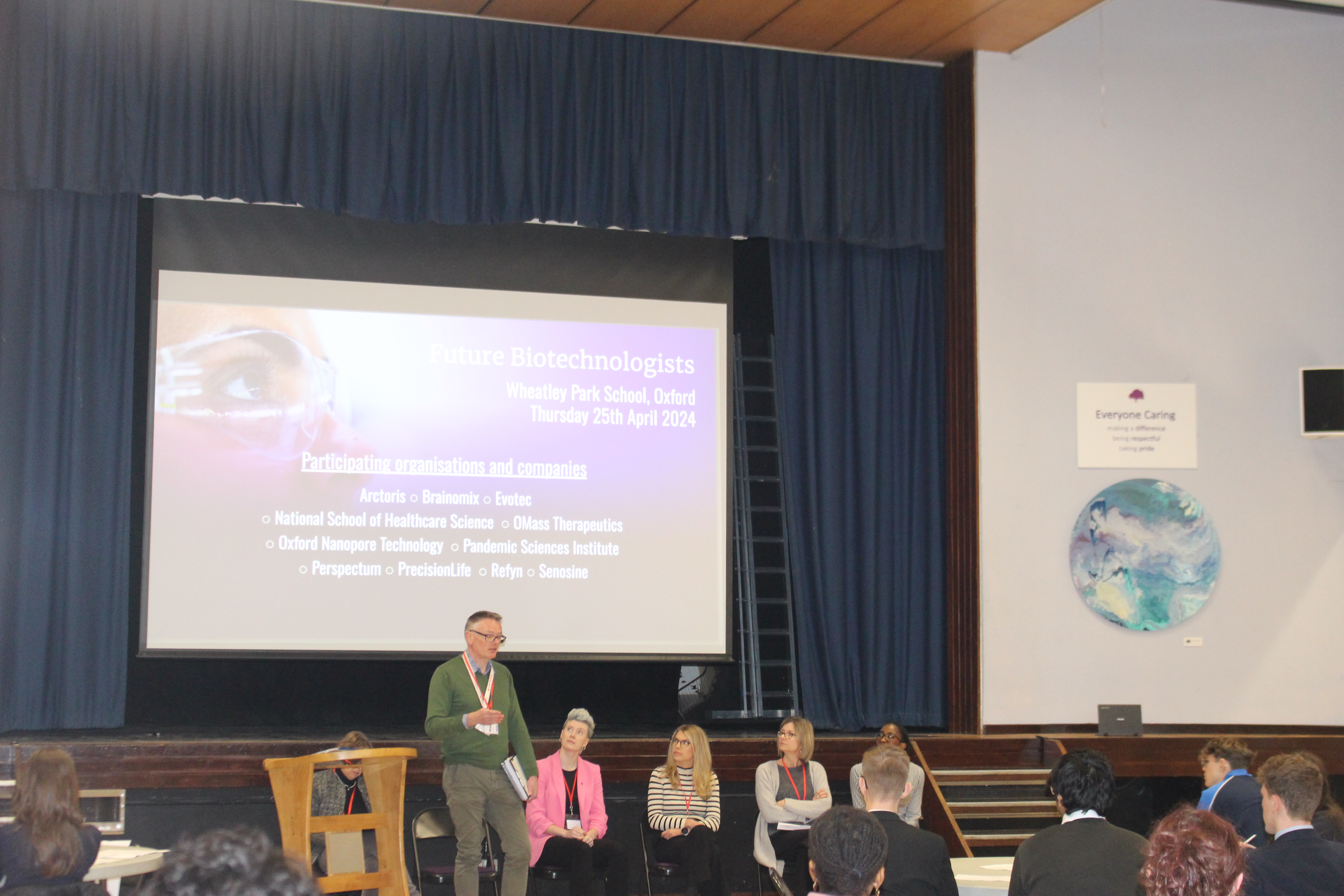 A picture of students and speakers during one of the panel sessions